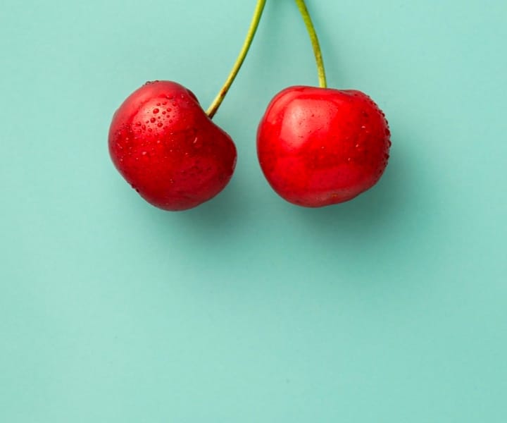cherries with greenish background